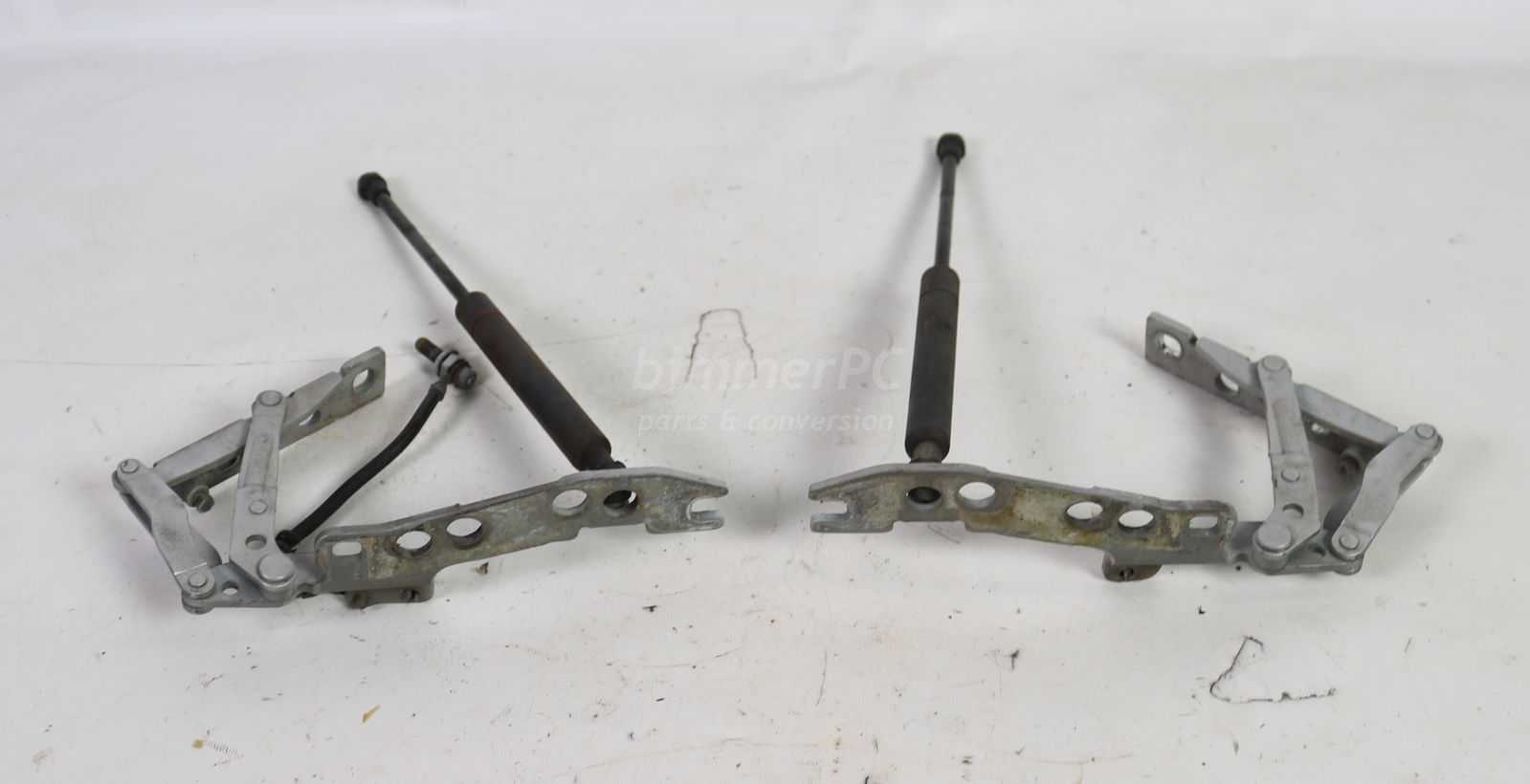 Picture of BMW  Front Hood Support Arms Hinges Mounts Set Pair E39 E52 for sale
